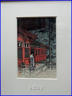 Hasui framed woodblock print, Woman in Front of a Temple after Rain (1930)