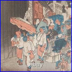 Japanese Woodblock print by Utagawa Hiroshige, titled Nihonbashi Morning Scene