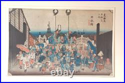 Japanese Woodblock print by Utagawa Hiroshige, titled Nihonbashi Morning Scene