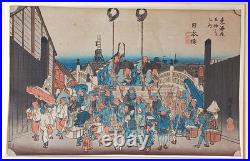 Japanese Woodblock print by Utagawa Hiroshige, titled Nihonbashi Morning Scene