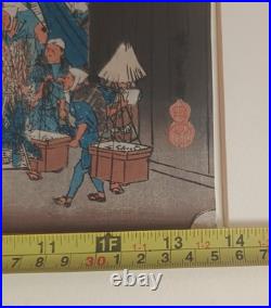 Japanese Woodblock print by Utagawa Hiroshige, titled Nihonbashi Morning Scene