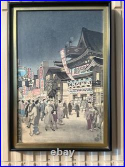 Vintage Japanese Woodblock Print Night Street Scene with Theater & Crowd