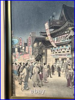 Vintage Japanese Woodblock Print Night Street Scene with Theater & Crowd